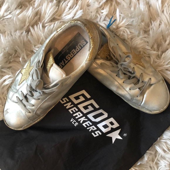 gold and silver golden goose sneakers